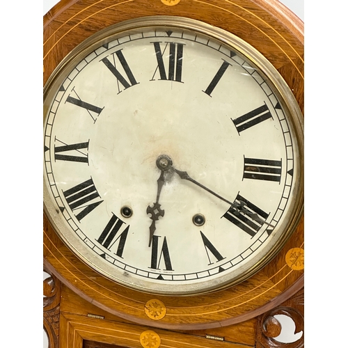 249 - A Late 19th Century inlaid walnut drop dial wall clock. With pendulum. 42x73cm