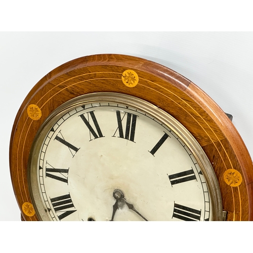 249 - A Late 19th Century inlaid walnut drop dial wall clock. With pendulum. 42x73cm