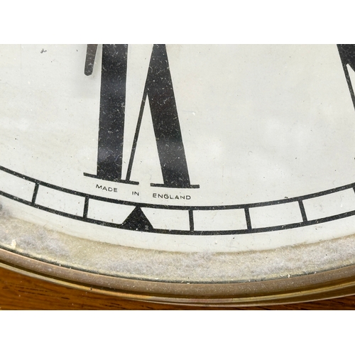 249 - A Late 19th Century inlaid walnut drop dial wall clock. With pendulum. 42x73cm