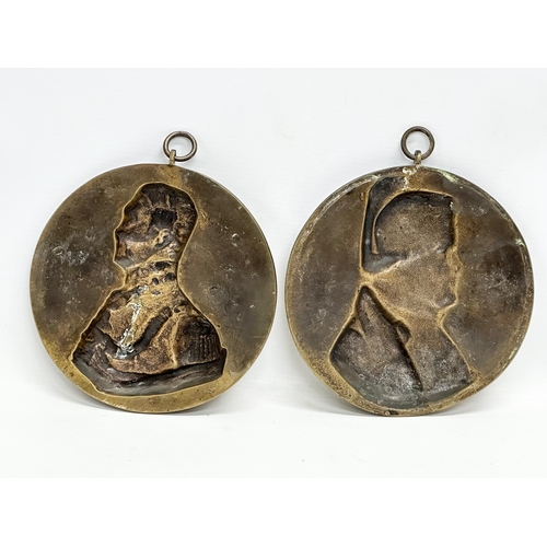 105 - A pair of 19th Century Wellington and Napoleon brass wall plaques. 17x20cm