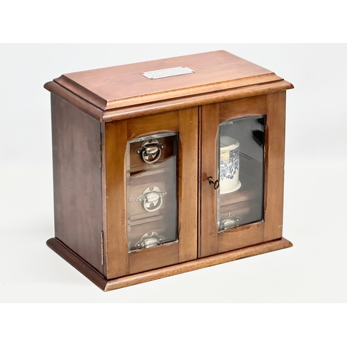 251 - An Early 20th Century mahogany smokers cabinet/humidor. With sterling silver presentation mount. 32.... 