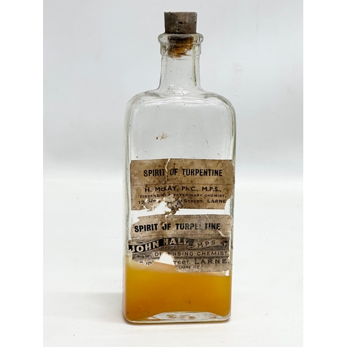 252 - A collection of Early 20th Century Northern Irish chemist bottles. 18cm, 19cm.