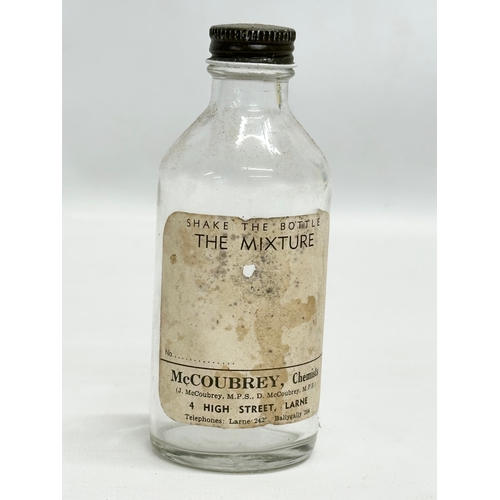 252 - A collection of Early 20th Century Northern Irish chemist bottles. 18cm, 19cm.