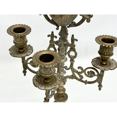 253 - 2 large brass candelabras. Late 19th and Early 20th Century. 22x41cm. 17x38cm