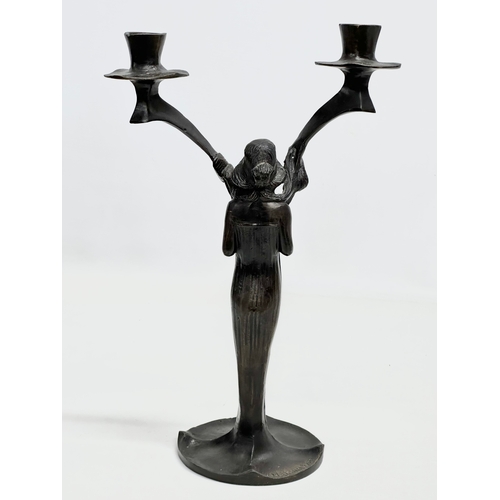 31 - Jules Moigniez (1835-1894) a pair of signed bronze Art Nouveau candelabras. In the manner of Jules M... 