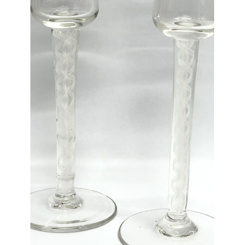 21 - A pair of 18th Century George III tall sherry glasses/wine glasses, with air twist stems. Circa 1760... 