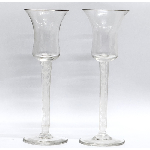 21 - A pair of 18th Century George III tall sherry glasses/wine glasses, with air twist stems. Circa 1760... 