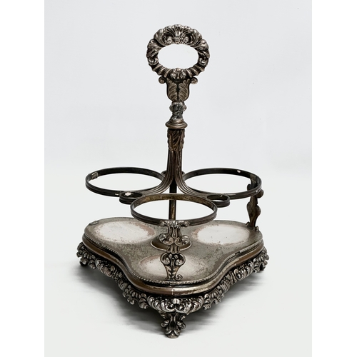 86 - Dan Holy, Parker & Co. An Early 19th Century George III silver plated decanter stand with 3 decanter... 