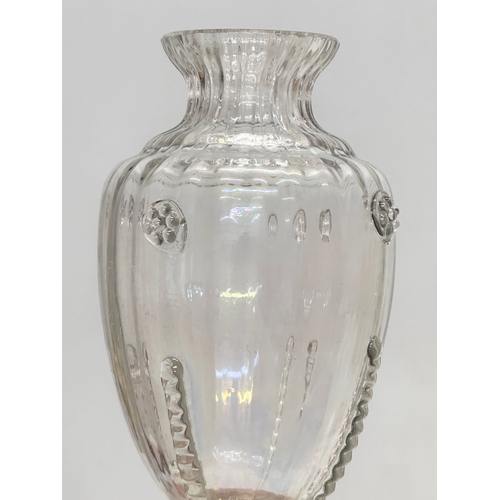 83 - An Early 20th Century iridescent glass vase. 18.5cm.