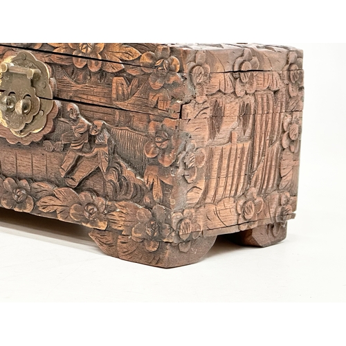 73 - A Late 19th Century Chinese carved camphor wood jewellery box. 24x13x13cm.