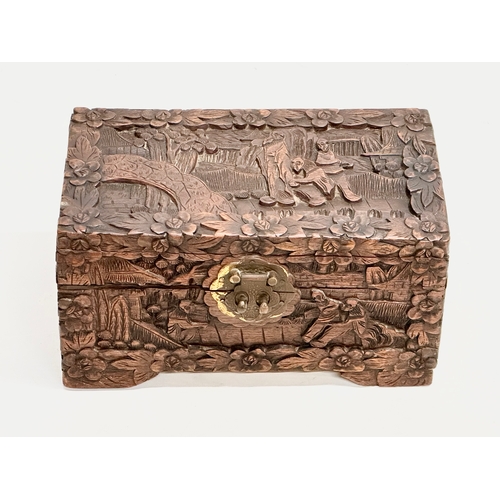 73 - A Late 19th Century Chinese carved camphor wood jewellery box. 24x13x13cm.