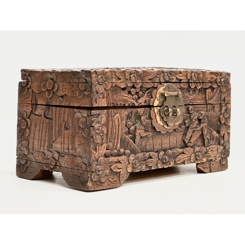 73 - A Late 19th Century Chinese carved camphor wood jewellery box. 24x13x13cm.