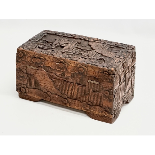 73 - A Late 19th Century Chinese carved camphor wood jewellery box. 24x13x13cm.