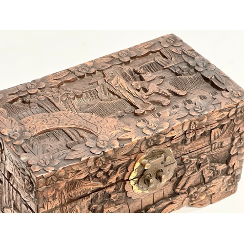 73 - A Late 19th Century Chinese carved camphor wood jewellery box. 24x13x13cm.