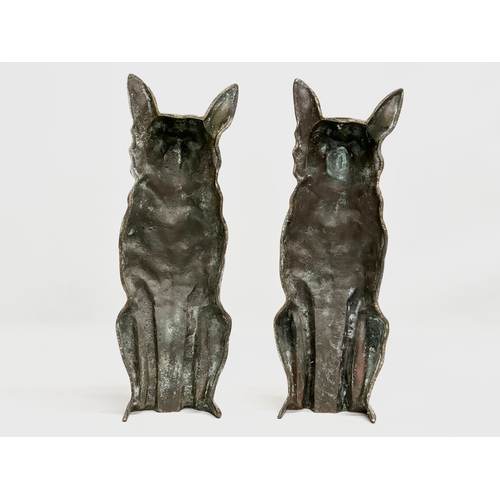 75 - A pair of large Late 19th Century brass fireside foxes. 42.5cm.