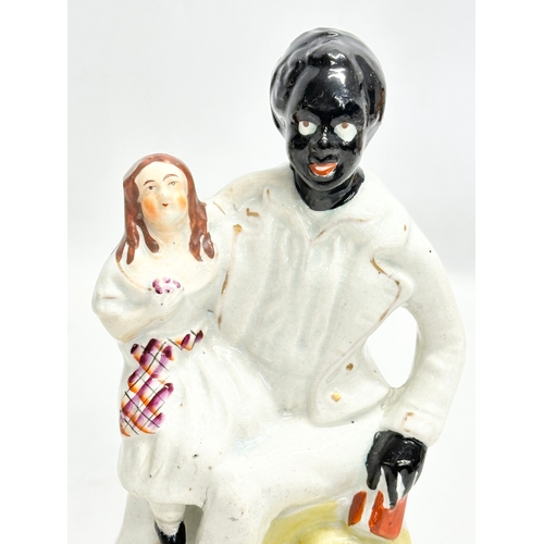 200 - A 19th Century Victorian Staffordshire Pottery ‘Uncle Tom & Eva’ 21cm.