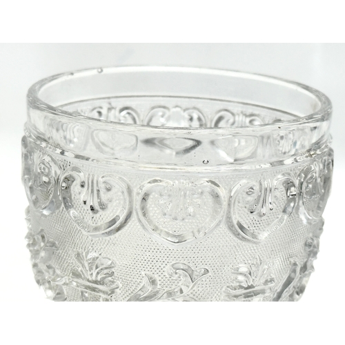 46 - A Mid 19th Century Baccarat pressed glass goblet. 9x14cm