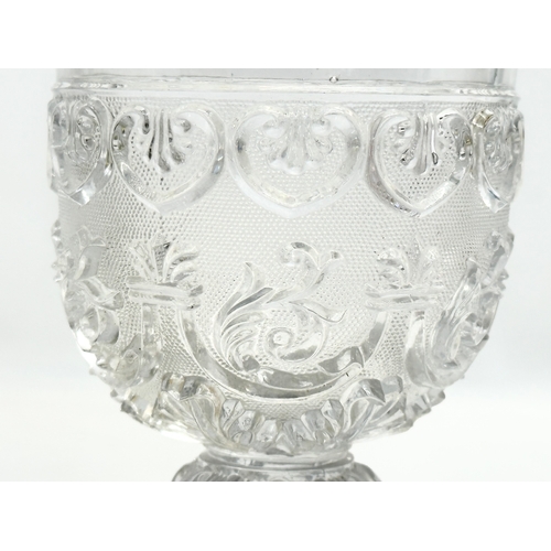 46 - A Mid 19th Century Baccarat pressed glass goblet. 9x14cm