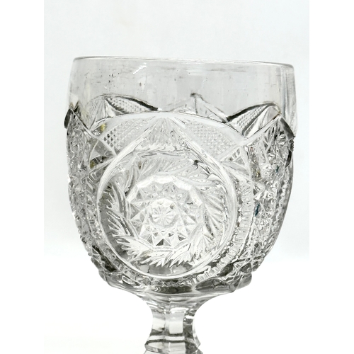 375 - 2 pieces of Late 19th Century American pressed glass. A goblet and water jug. 9x16cm. 11x11cm.