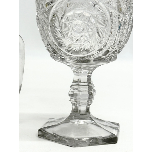 375 - 2 pieces of Late 19th Century American pressed glass. A goblet and water jug. 9x16cm. 11x11cm.