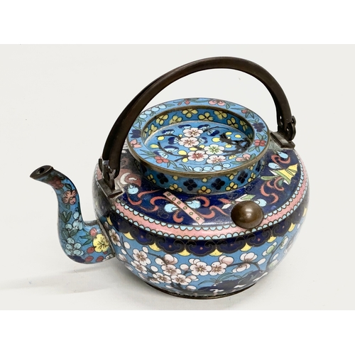 51 - A 19th Century Chinese cloisonné enamelled teapot with cover. With doubled looped brass handle. 17x1... 