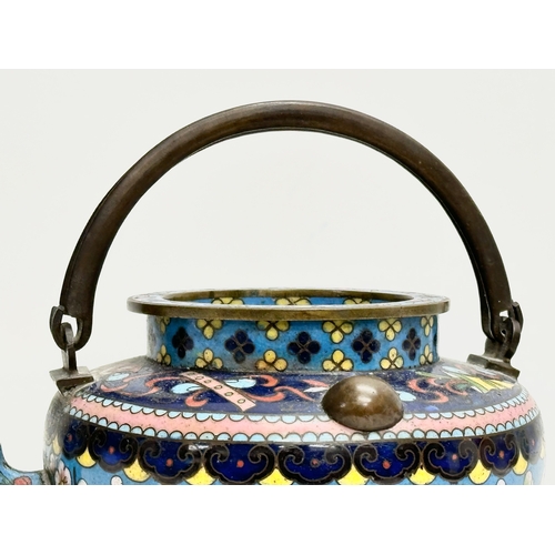 51 - A 19th Century Chinese cloisonné enamelled teapot with cover. With doubled looped brass handle. 17x1... 