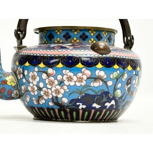 51 - A 19th Century Chinese cloisonné enamelled teapot with cover. With doubled looped brass handle. 17x1... 