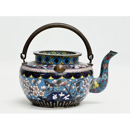 51 - A 19th Century Chinese cloisonné enamelled teapot with cover. With doubled looped brass handle. 17x1... 