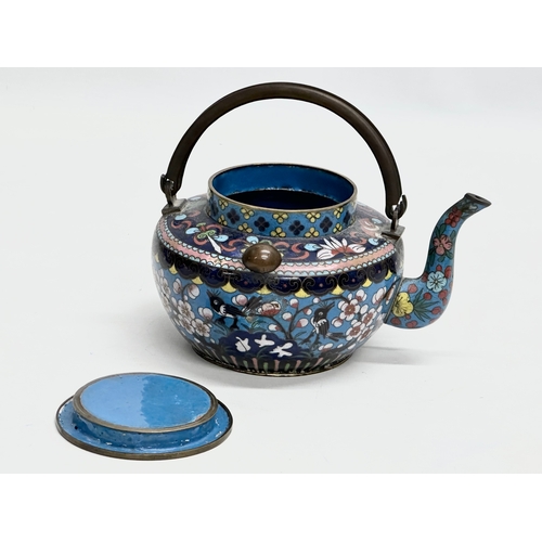 51 - A 19th Century Chinese cloisonné enamelled teapot with cover. With doubled looped brass handle. 17x1... 