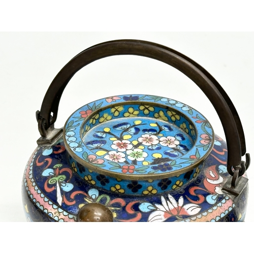 51 - A 19th Century Chinese cloisonné enamelled teapot with cover. With doubled looped brass handle. 17x1... 