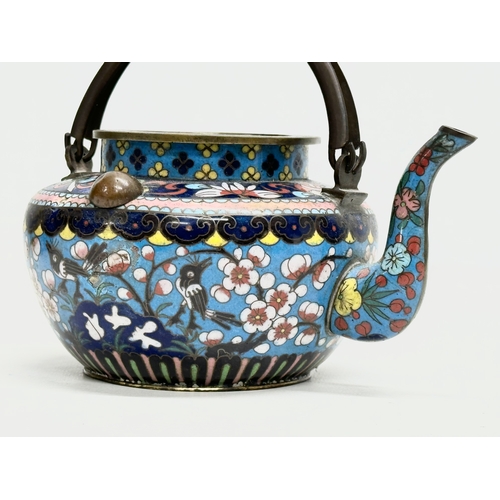 51 - A 19th Century Chinese cloisonné enamelled teapot with cover. With doubled looped brass handle. 17x1... 