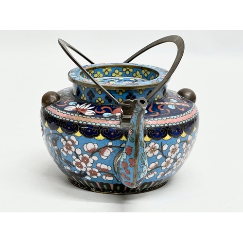 51 - A 19th Century Chinese cloisonné enamelled teapot with cover. With doubled looped brass handle. 17x1... 