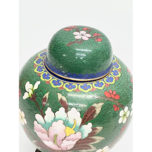 53 - An Early 20th Century Chinese cloisonné enamelled jar with lid and wooden base. 11x14cm without stan... 