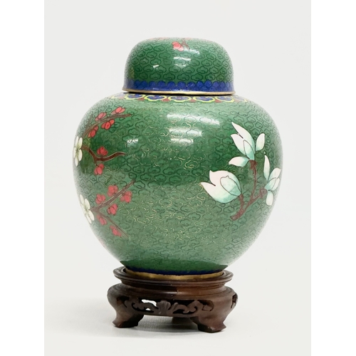 53 - An Early 20th Century Chinese cloisonné enamelled jar with lid and wooden base. 11x14cm without stan... 