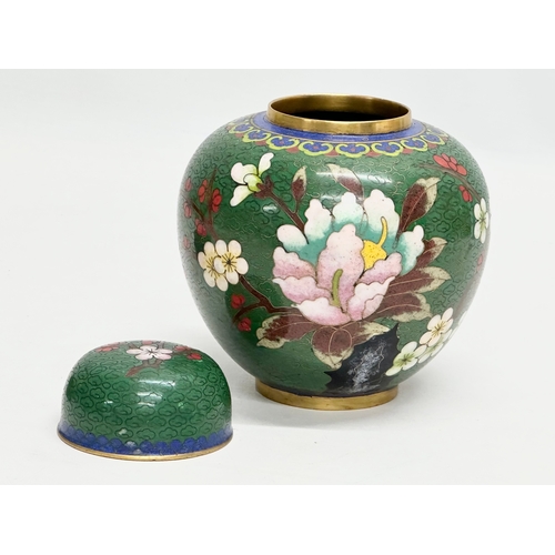 53 - An Early 20th Century Chinese cloisonné enamelled jar with lid and wooden base. 11x14cm without stan... 