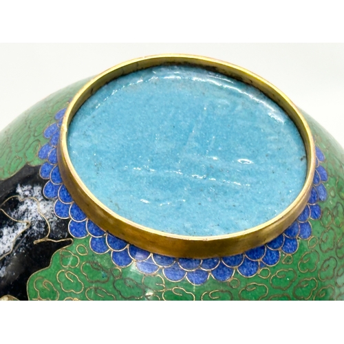 53 - An Early 20th Century Chinese cloisonné enamelled jar with lid and wooden base. 11x14cm without stan... 