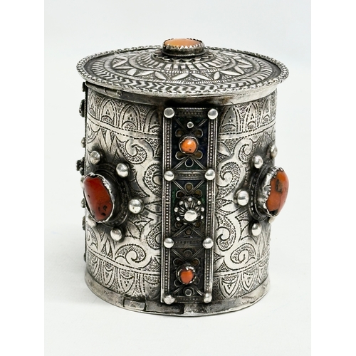 11 - A 19th Century Algerian silver and coral canister. 10x11.5cm.