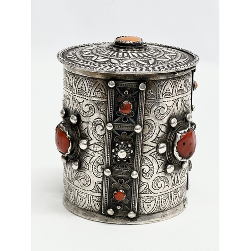 11 - A 19th Century Algerian silver and coral canister. 10x11.5cm.