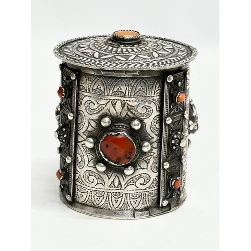 11 - A 19th Century Algerian silver and coral canister. 10x11.5cm.