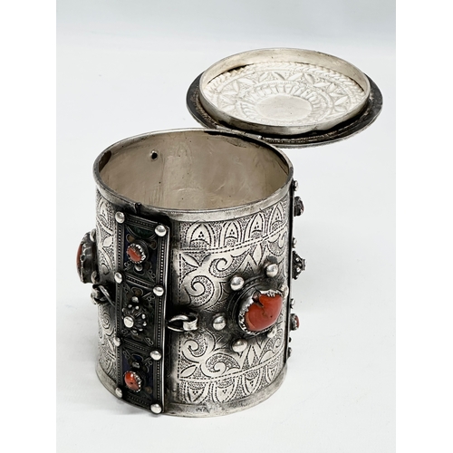 11 - A 19th Century Algerian silver and coral canister. 10x11.5cm.