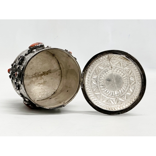 11 - A 19th Century Algerian silver and coral canister. 10x11.5cm.