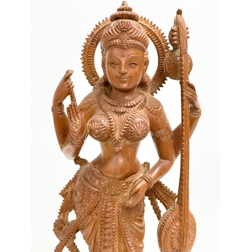 113 - A large Early 20th Century finely carved boxwood Apsara statue on padauk base. 18x11x42cm.