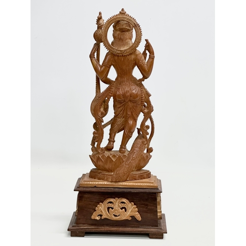 113 - A large Early 20th Century finely carved boxwood Apsara statue on padauk base. 18x11x42cm.