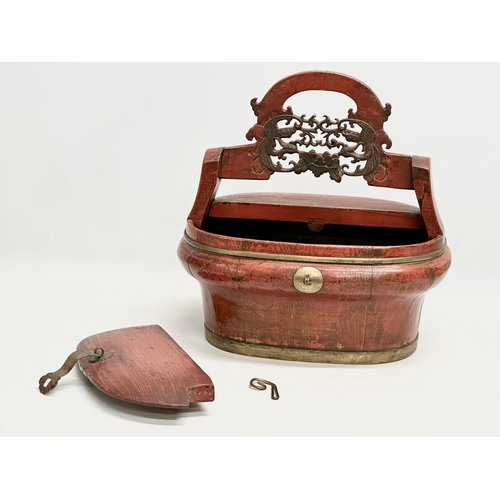 48 - A Late 19th Century Chinese lacquered pine, brass bound wedding box. 34x28x35cm including handle.