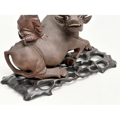 89 - A good quality Early 20th Century Chinese carved boxwood water buffalo and rider. With glass eyes an... 