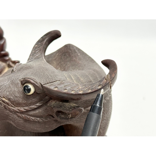 89 - A good quality Early 20th Century Chinese carved boxwood water buffalo and rider. With glass eyes an... 