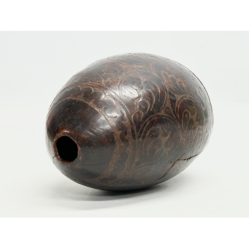 3 - A Late 18th/Early 19th Century Bugbear coconut flask. 20cm