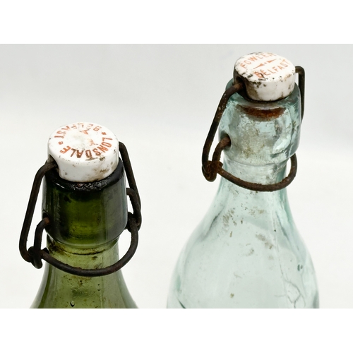 444 - 3 Early 20th Century glass bottles. 2 by Fowler of Belfast and a green gin bottle. 29cm