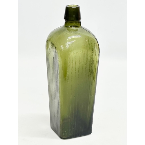 444 - 3 Early 20th Century glass bottles. 2 by Fowler of Belfast and a green gin bottle. 29cm