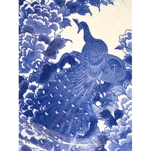 163 - A very large 19th Century Japanese Arita blue and white charger. Meiji Period (1868-1912) 45x5.5cm